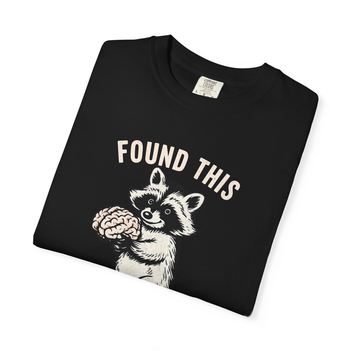 Found This Raccoon Holding Brain T-Shirt — "FOUND THIS / FIGURED IT WAS YOURS"