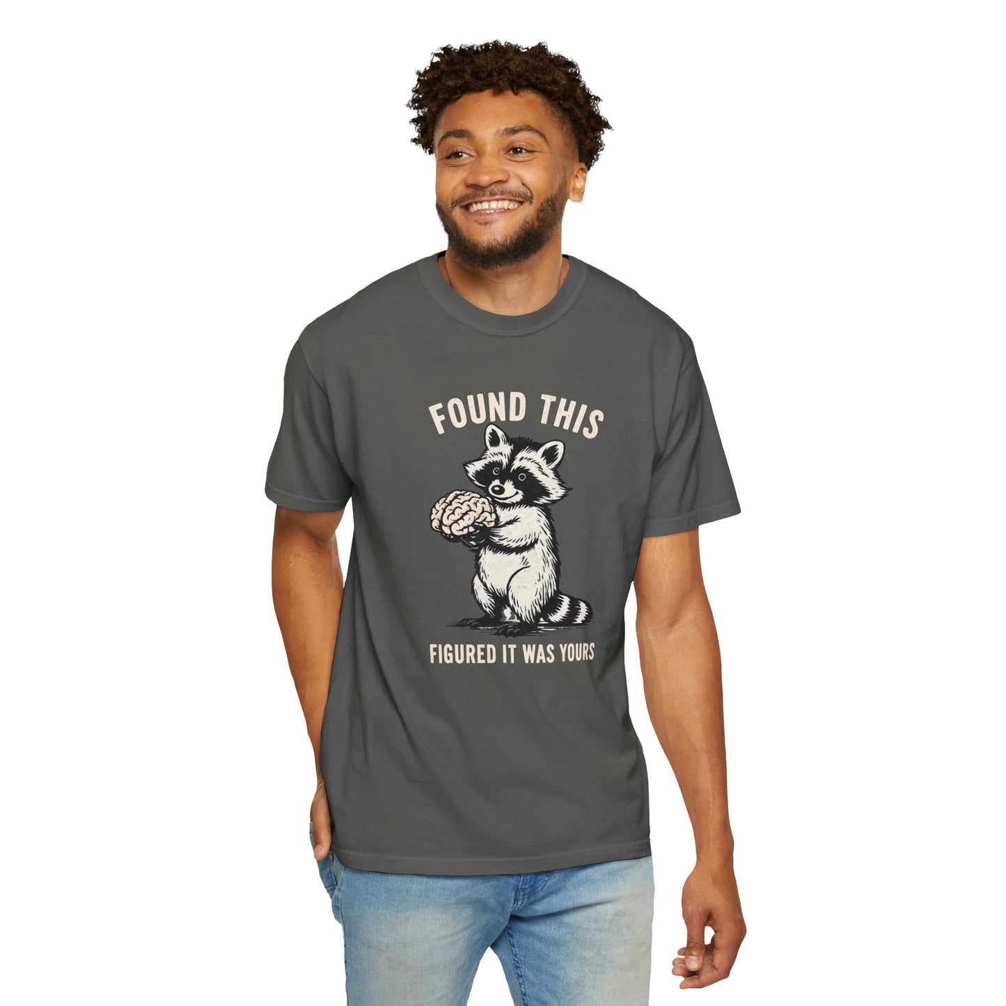 Found This Raccoon Holding Brain T-Shirt — "FOUND THIS / FIGURED IT WAS YOURS"