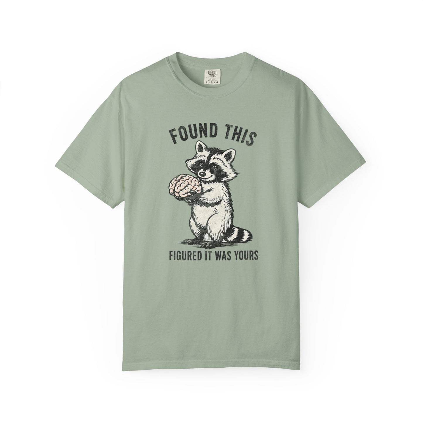 Found This Raccoon Holding Brain T-Shirt — "FOUND THIS / FIGURED IT WAS YOURS"