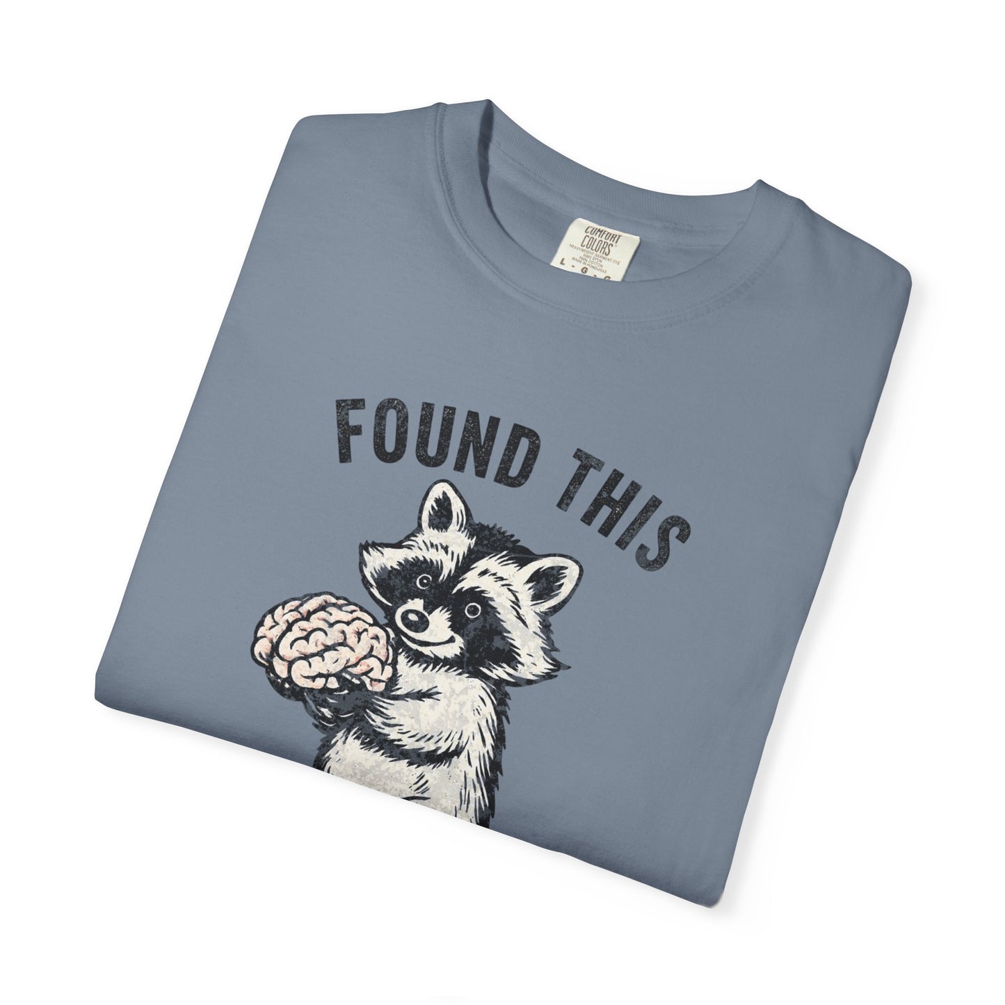 Found This Raccoon Holding Brain T-Shirt — "FOUND THIS / FIGURED IT WAS YOURS"
