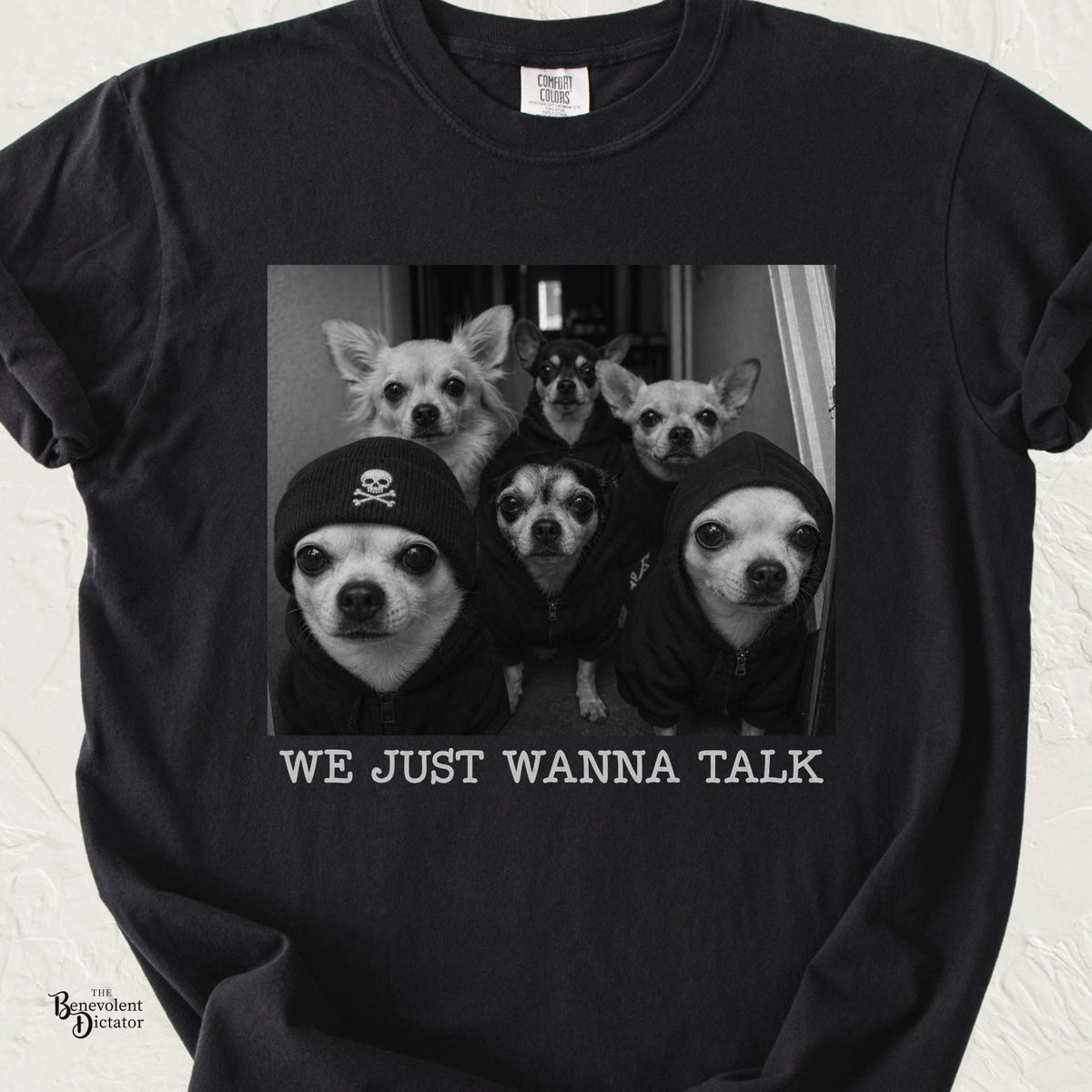 Black Comfort Colors t-shirt featuring a black-and-white photo of six intimidating Chihuahuas in hoodies and a skull beanie above the words “We Just Wanna Talk.”