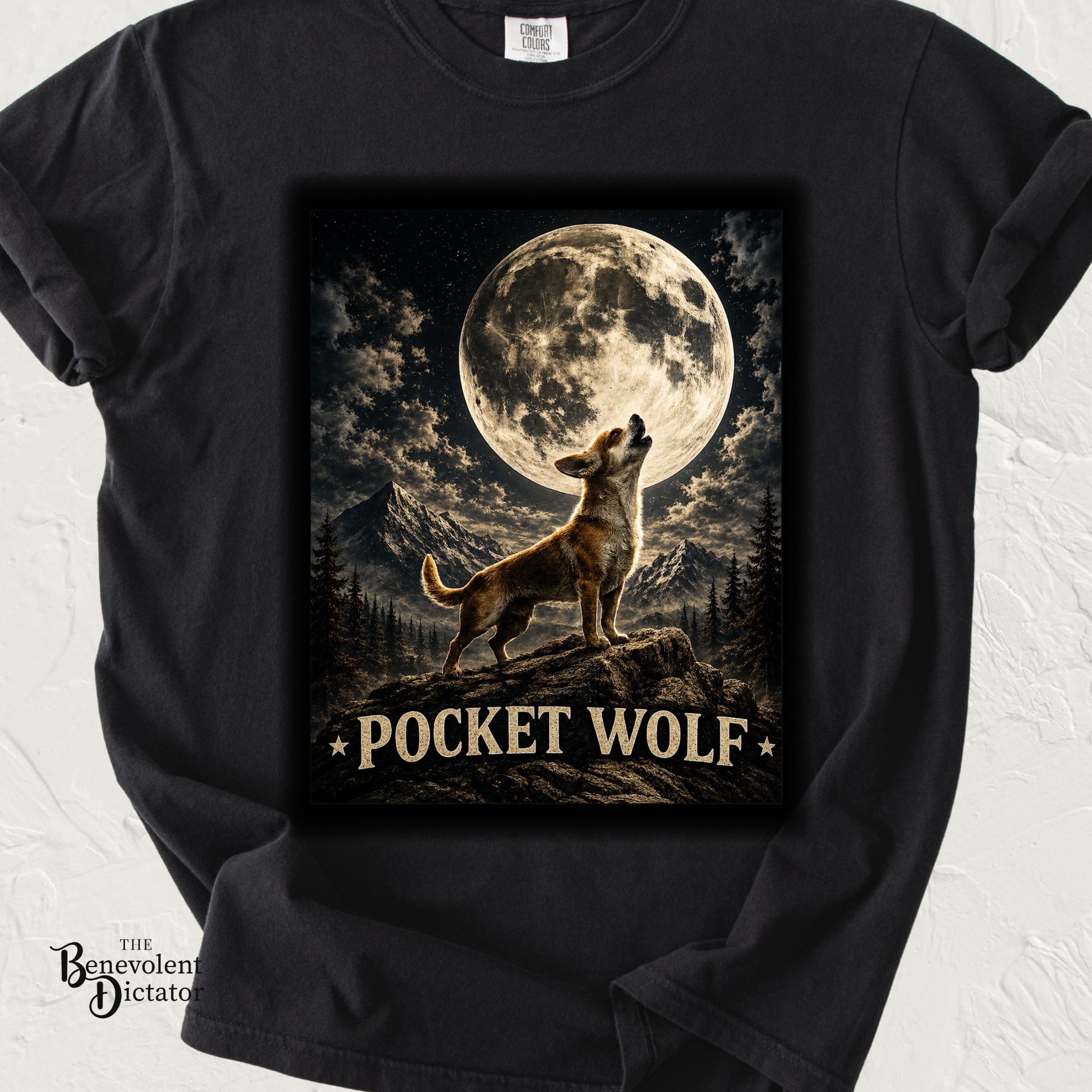 Funny graphic t-shirt featuring a small dog howling at the moon with the phrase “Pocket Wolf.”