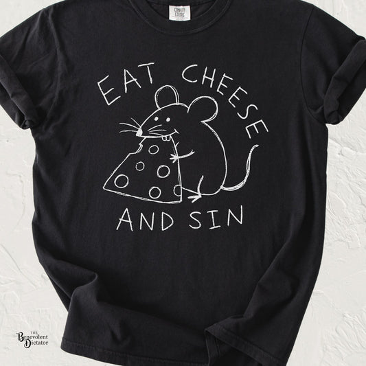 Black graphic t-shirt featuring childlike hand-drawn text reading “Eat Cheese and Sin” with a doodle mouse hugging and eating a wedge of cheese.