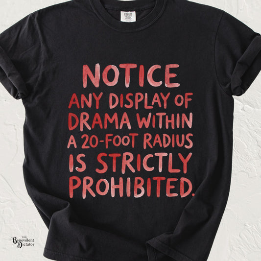 Black Comfort Colors t-shirt featuring bold distressed red typography reading: "NOTICE: Any display of drama within a 20-foot radius is strictly prohibited."
