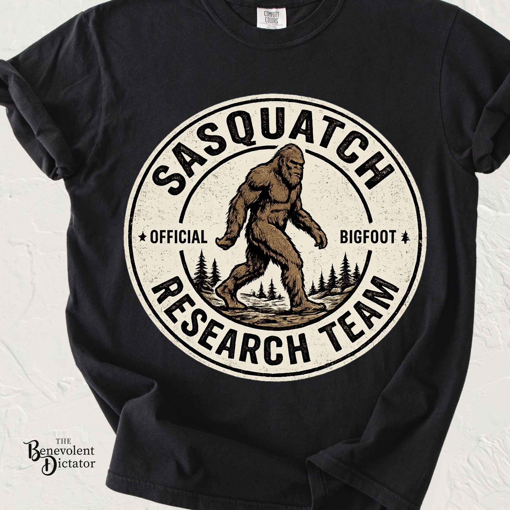 Vintage badge-style t-shirt featuring Bigfoot with the phrase Sasquatch Research Team in distressed lettering.