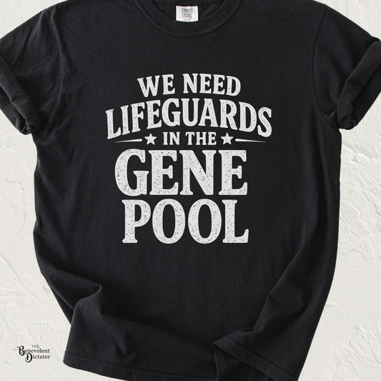 Black Comfort Colors t-shirt featuring distressed cream typography that reads “We Need Lifeguards in the Gene Pool.”