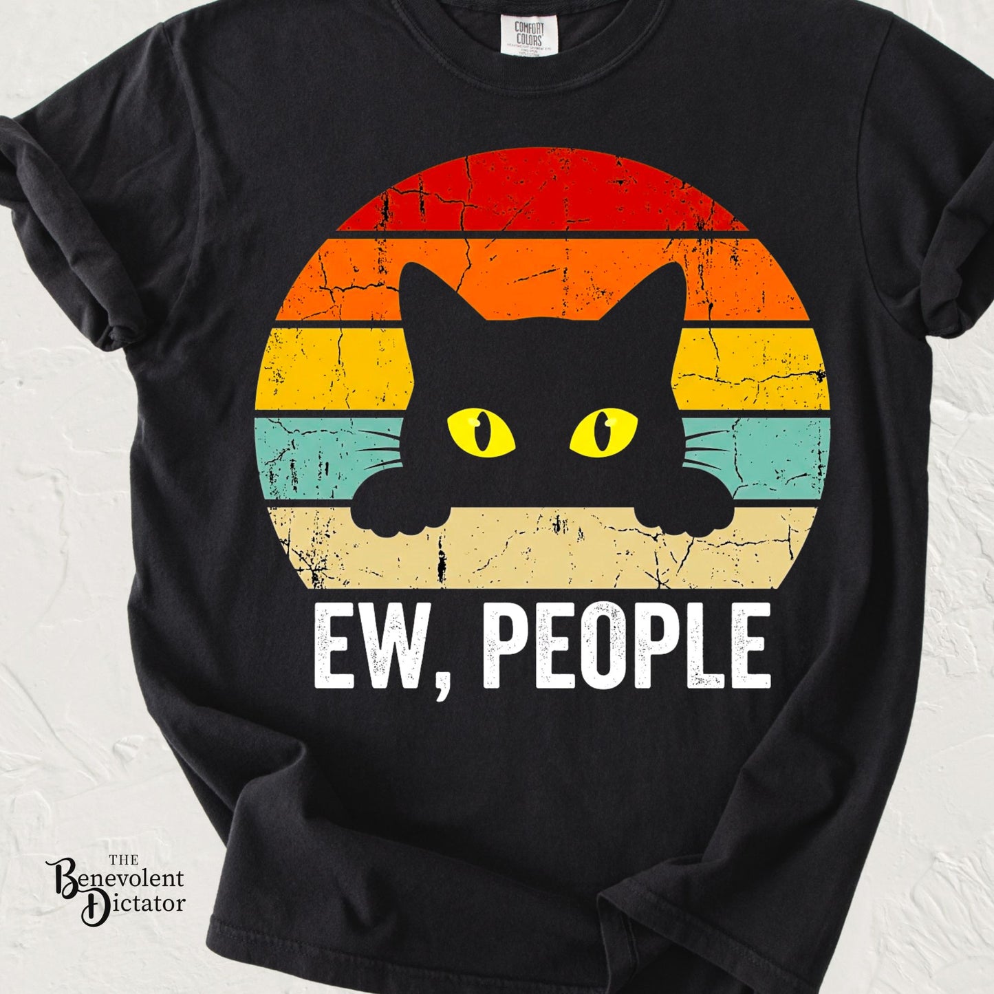 Funny cat t-shirt featuring a black cat peeking over a retro sunset design with the phrase Ew, People.