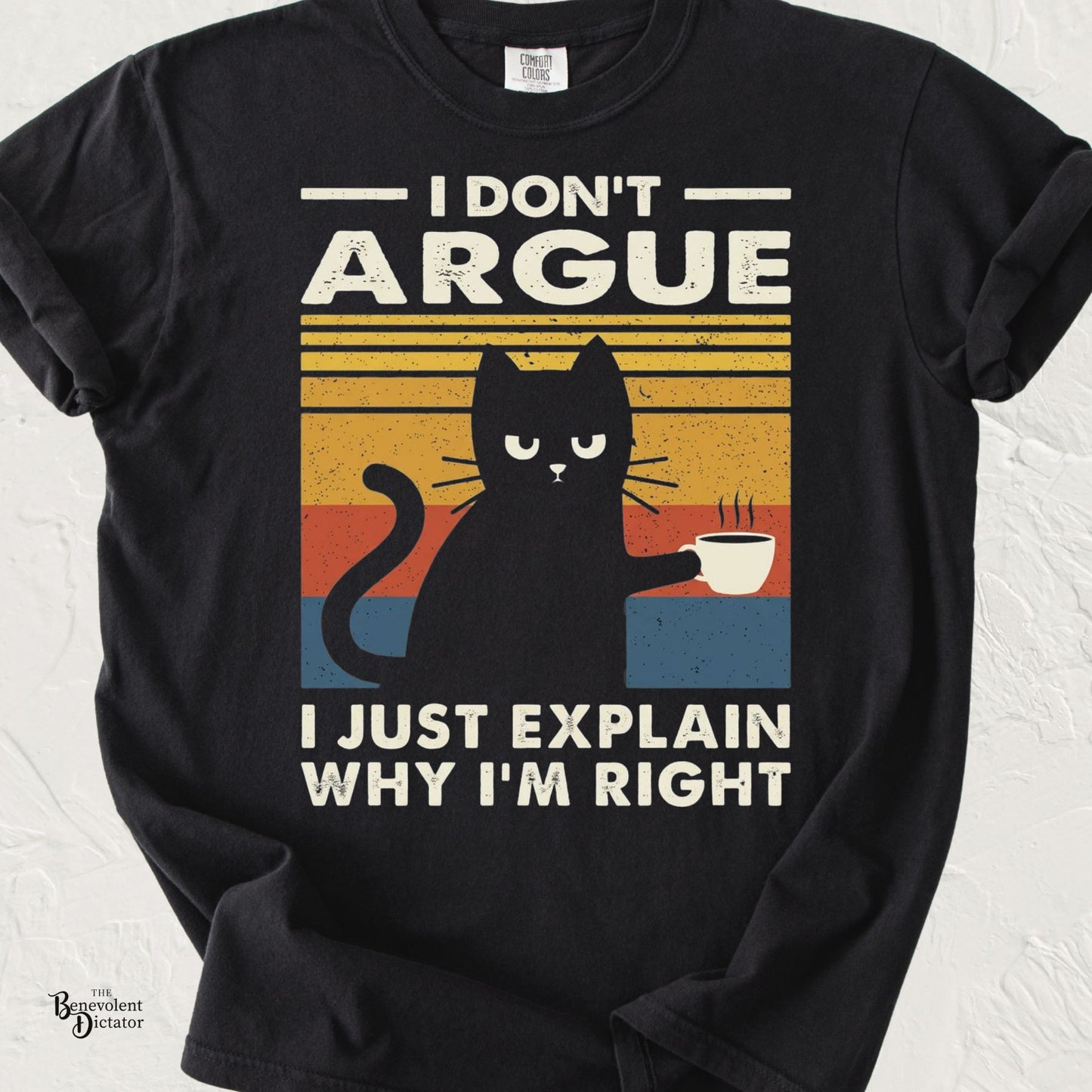 Vintage-style black cat holding a coffee cup with the phrase "I Don't Argue, I Just Explain Why I'm Right" on a Comfort Colors® t-shirt.