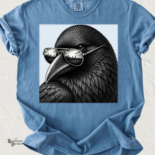 Close-up black crow wearing reflective aviator sunglasses with a city skyline reflected in the lenses, illustrated in detailed monochrome on a transparent background.