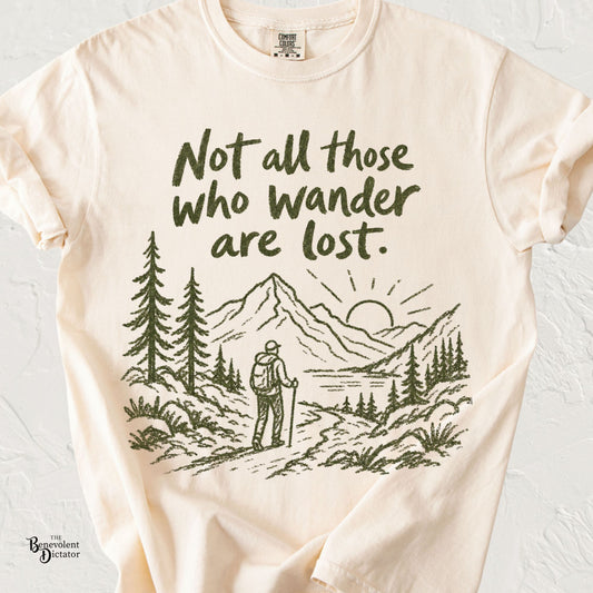 Vintage hiking graphic featuring a mountain landscape, pine trees, and a backpacker with the phrase "Not all those who wander are lost."