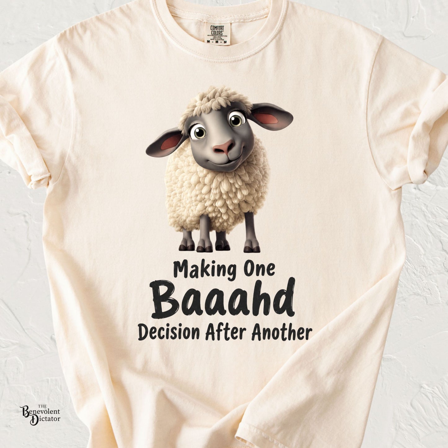 Cute fluffy lamb with the phrase "Making One Baaahd Decision After Another" on a Comfort Colors® t-shirt.