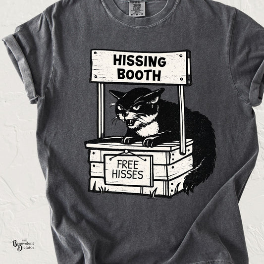 Funny cat t-shirt featuring an angry cat in a booth labeled Hissing Booth with a sign offering Free Hisses.