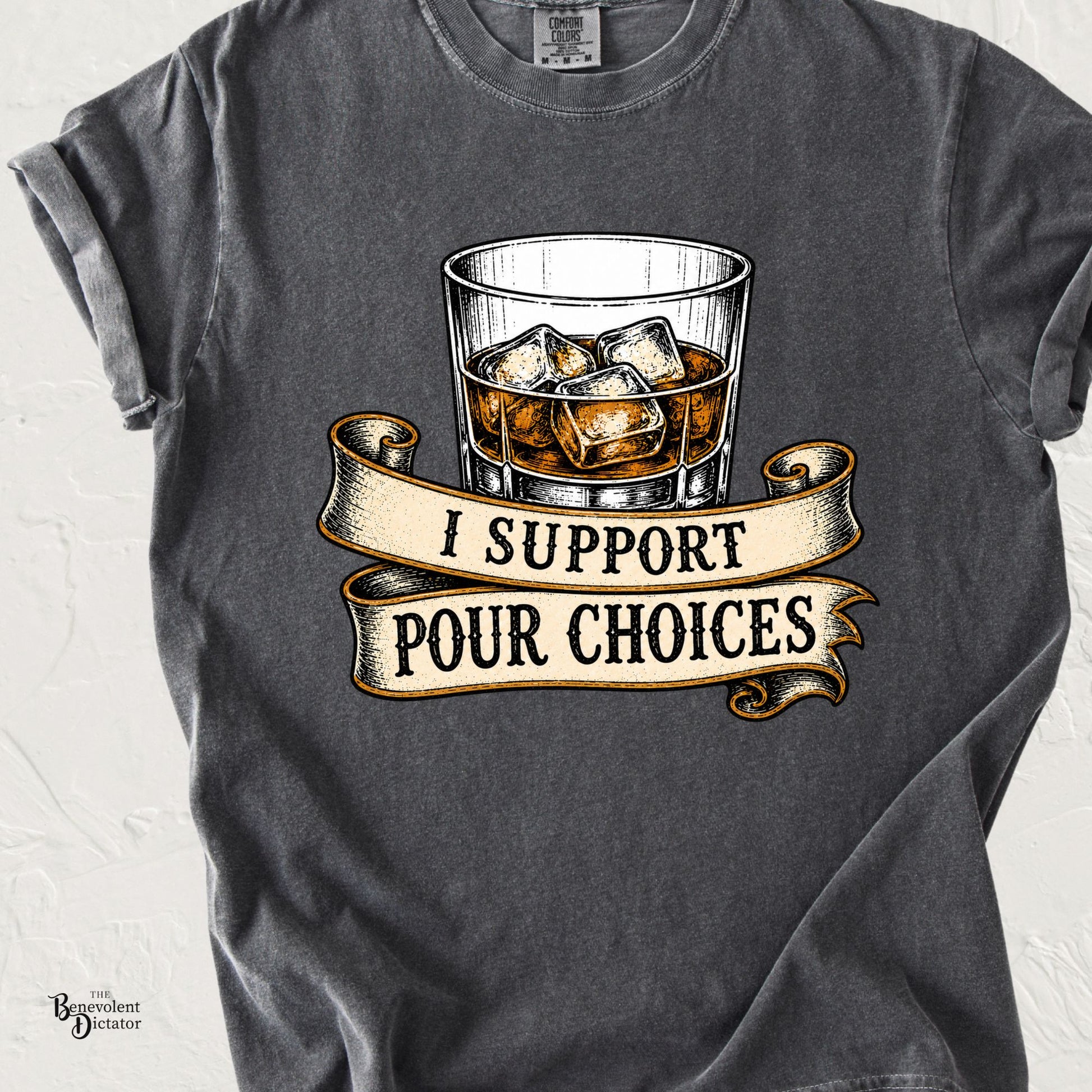 Pepper gray Comfort Colors t-shirt featuring a vintage whiskey glass with ice and banner text that reads “I Support Pour Choices.”