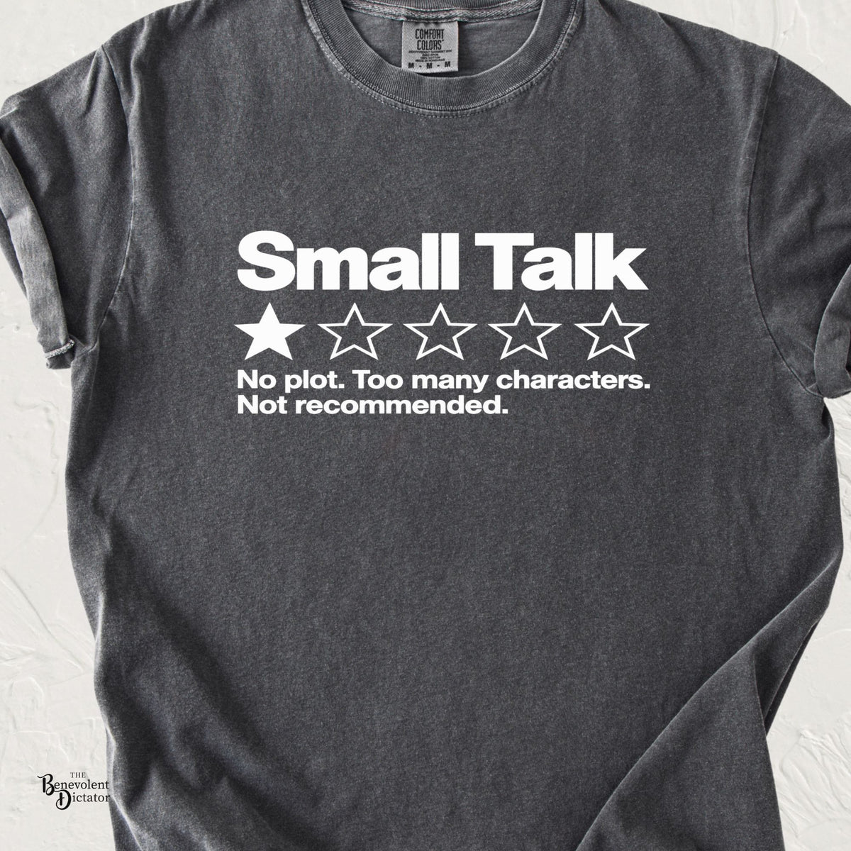 Pepper Comfort Colors t-shirt featuring a bold white Small Talk review graphic with one out of five stars and the text “No plot. Too many characters. Not recommended.”