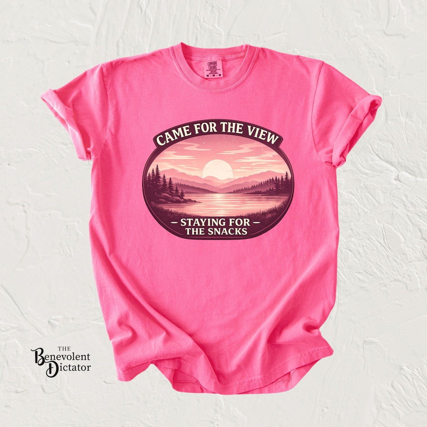 feminine t-shirt with a pink and coral campging graphic design and text on a white background