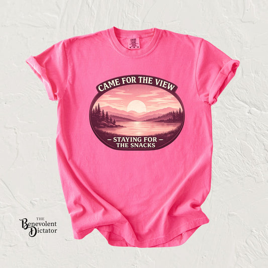 feminine t-shirt with a pink and coral campging graphic design and text on a white background