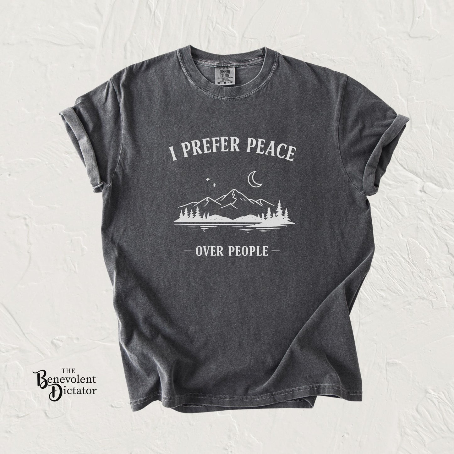 Black t-shirt with 'I Prefer Peace Over People' graphic on a textured white background