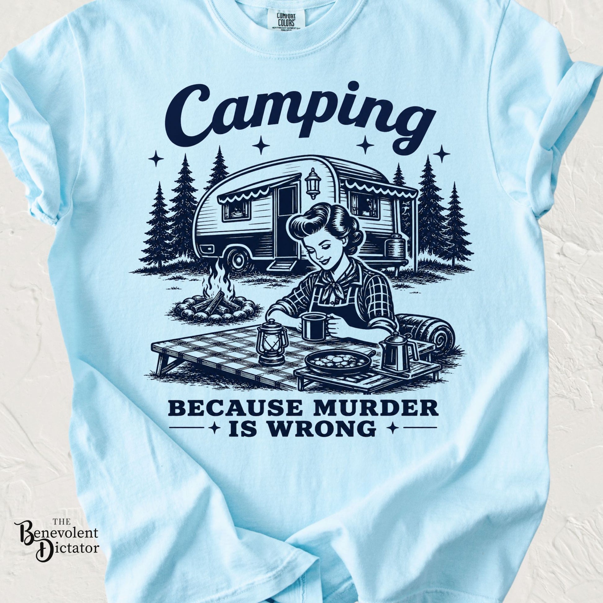 Funny camping t-shirt featuring a vintage camping scene with the phrase Camping Because Murder Is Wrong.