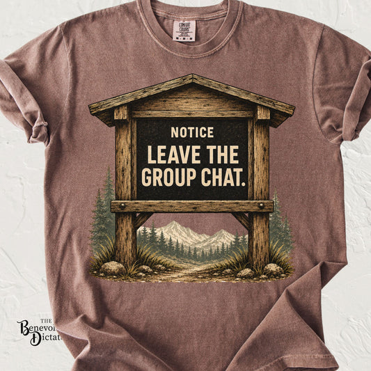 Vintage national park trailhead sign featuring the phrase "Notice: Leave the Group Chat" with mountains and pine trees on a Comfort Colors® t-shirt.